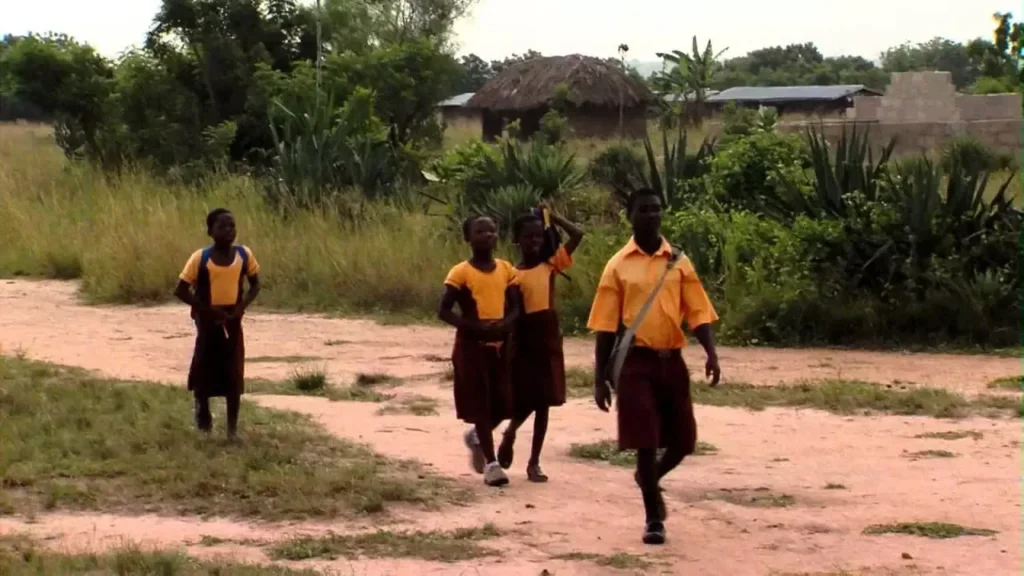 young Ghanaian learner walking miles to school