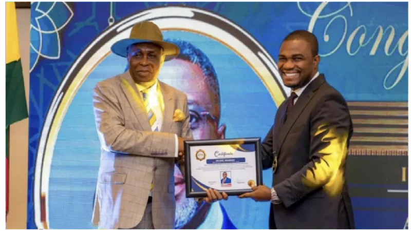 Picture of Dr. Eric Nkansah receiving APSO award