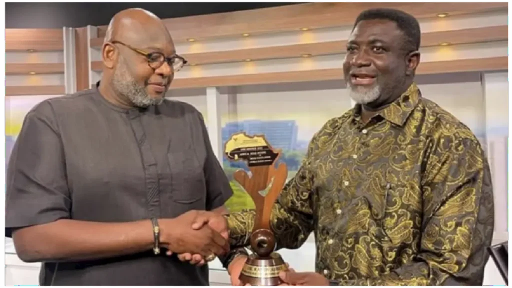 Picture of Dr. Randy Abbey receiving Top African Excellence Award