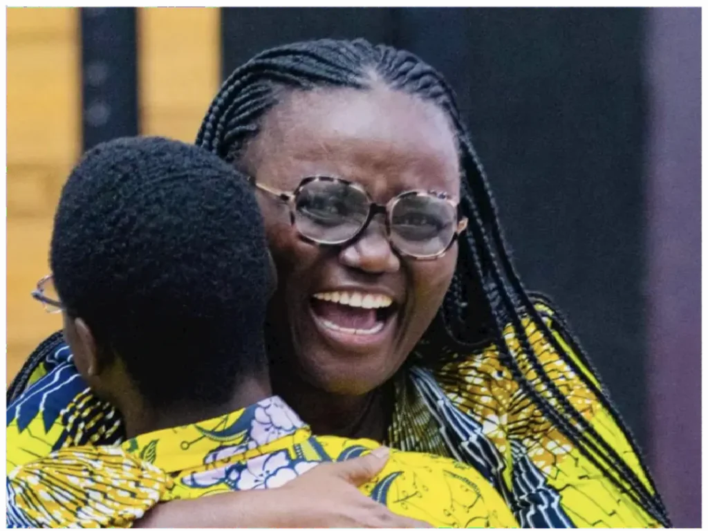 Picture of Enning Mensah Joseph joyfully hugging KNUST Vice-Chancellor