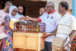 Picture of Ernest Yaw Anim donating trucks and chop boxes