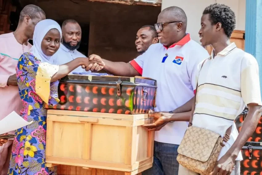 Picture of Ernest Yaw Anim donating trucks and chop boxes