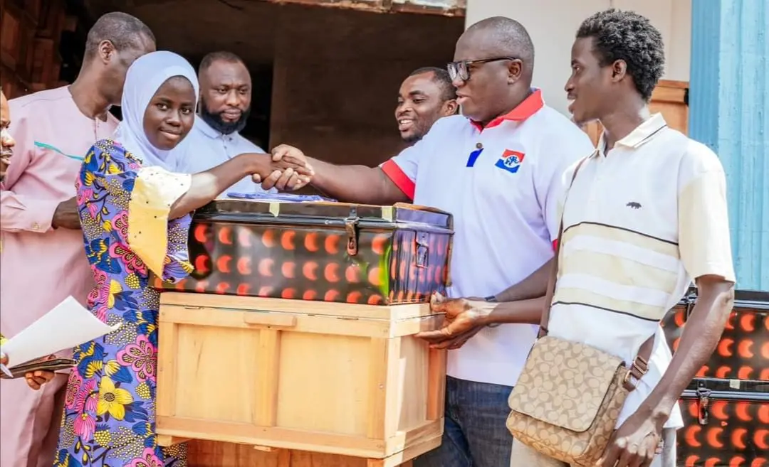 Picture of Ernest Yaw Anim donating trucks and chop boxes