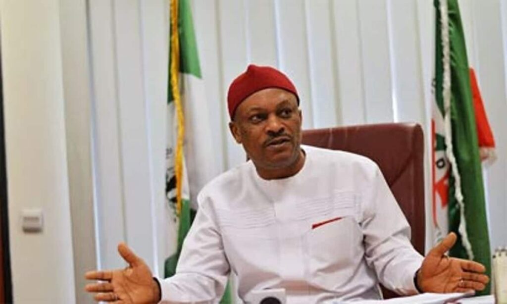 photo of Samuel Anyanwu of the APC sitting in his office with his arms open