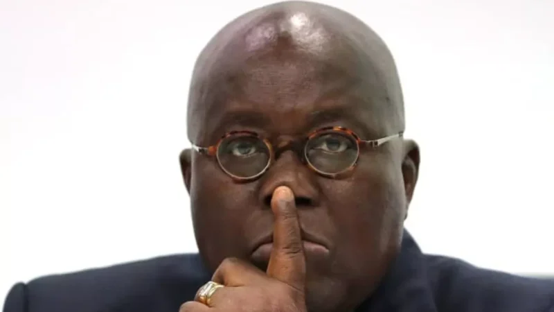 post thumbnail image of ghana's president nana akuffo addo with his finger on his lips