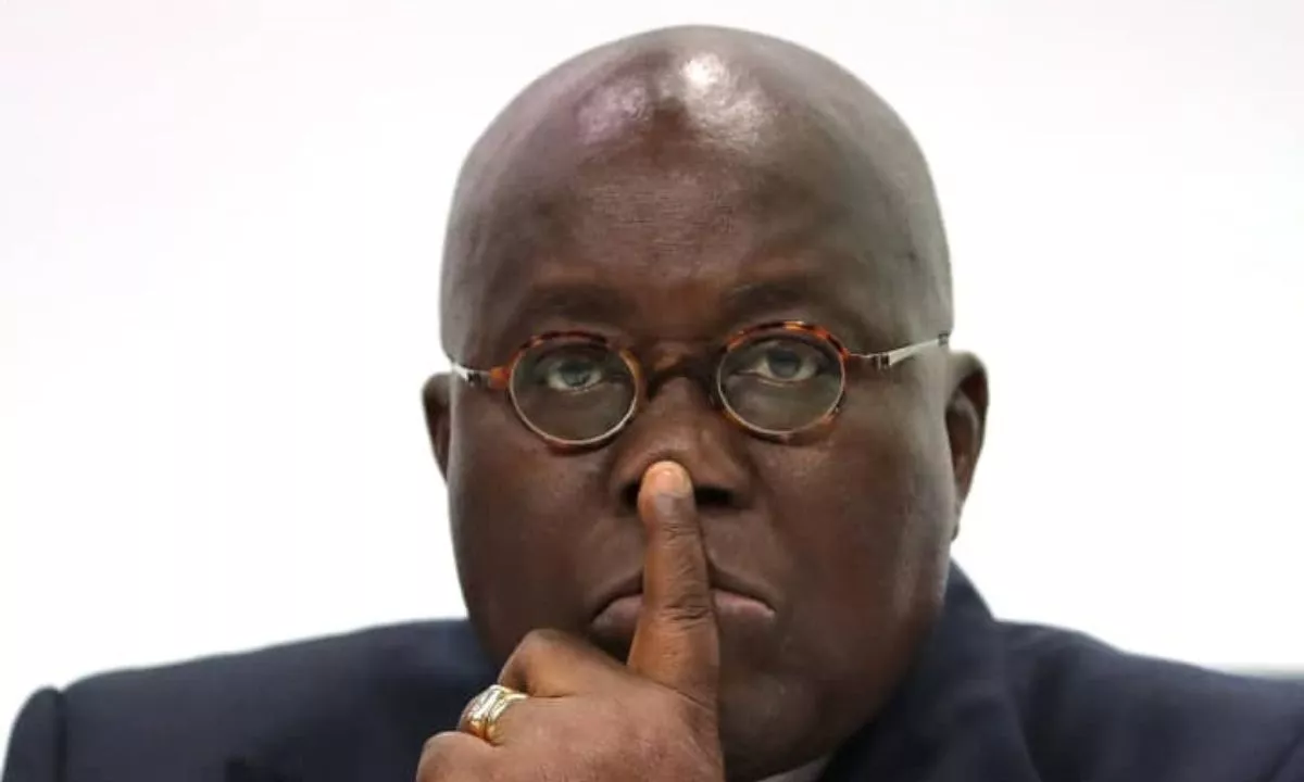 post thumbnail image of ghana's president nana akuffo addo with his finger on his lips